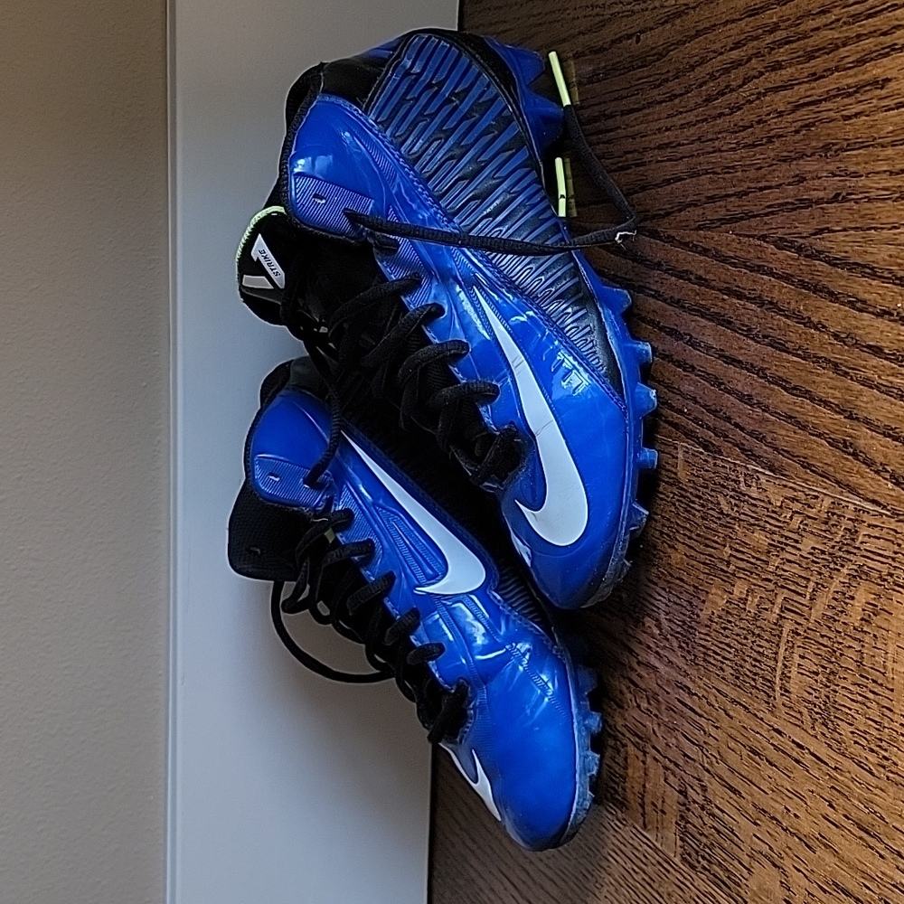 Nike kids football cleats, size 5, blue and black.